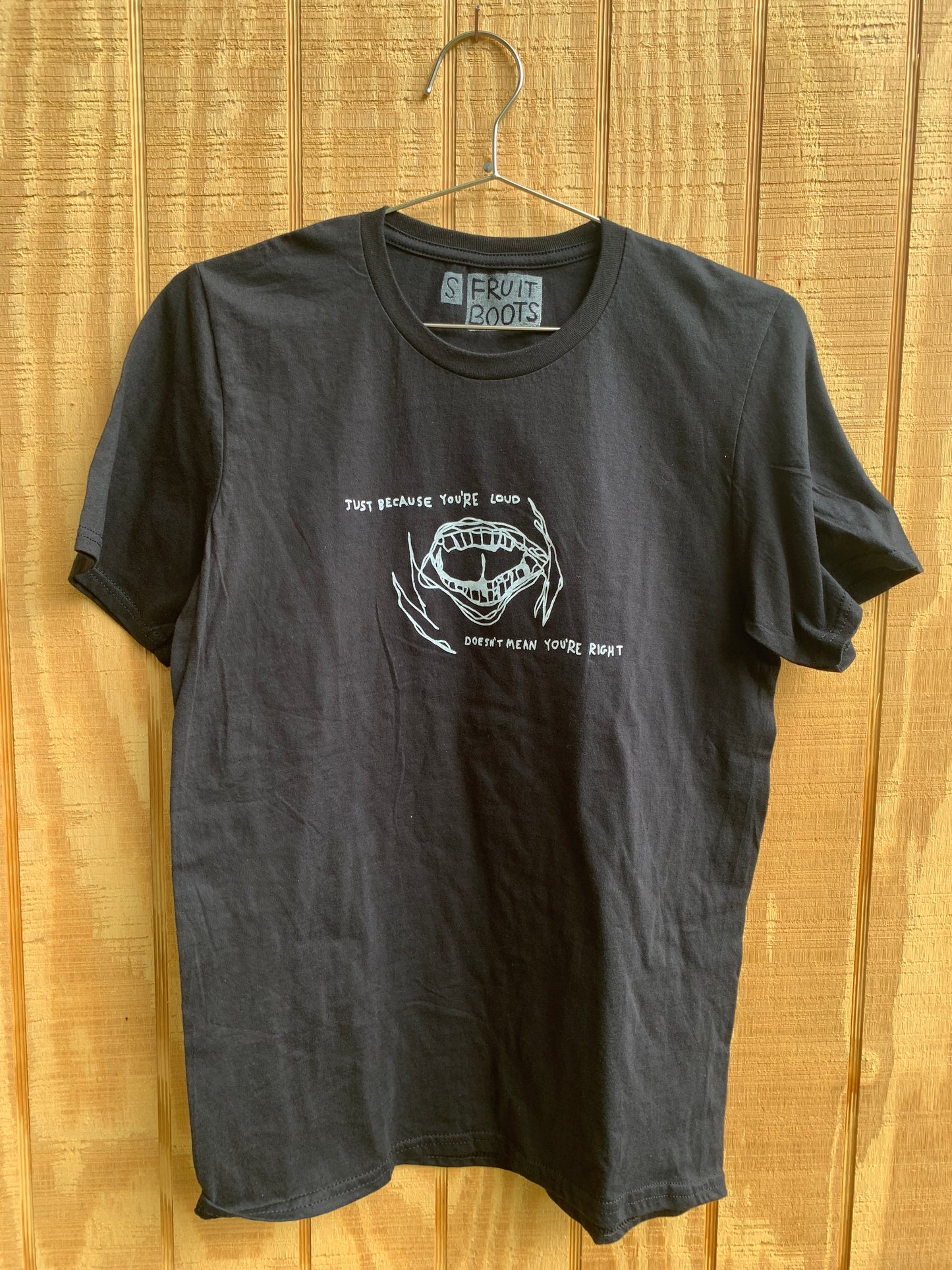 Black T SHirt with white blind contour drawing of a mouth with white text that reads "just because you're loud, doesn't mean you're right"
